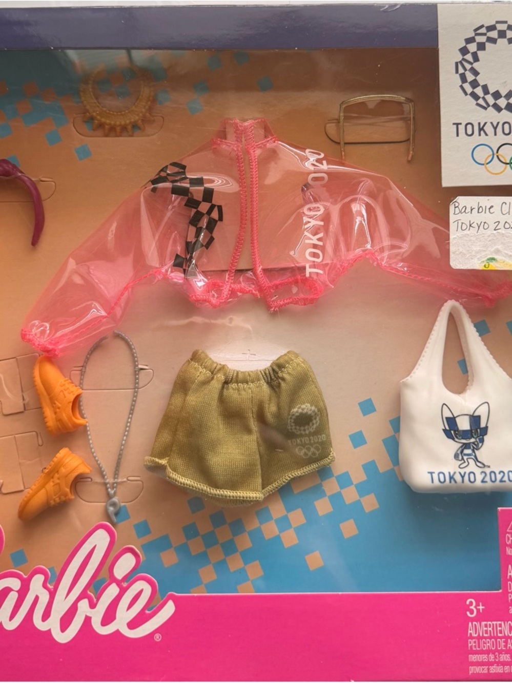 Barbie Pink Translucent Jacket with Olive Shorts and White Tokyo 2020
